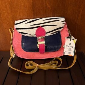 New Soruka “Gemma” crossbody bag in Pink, Blue and animal print.